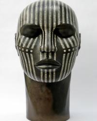 Raku fired ceramic tribal head, black, with white crackled thin lines and dots